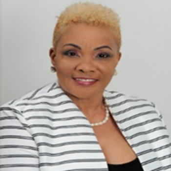 The Right Hon. Rita J. Gardiner, OBE, OTCI